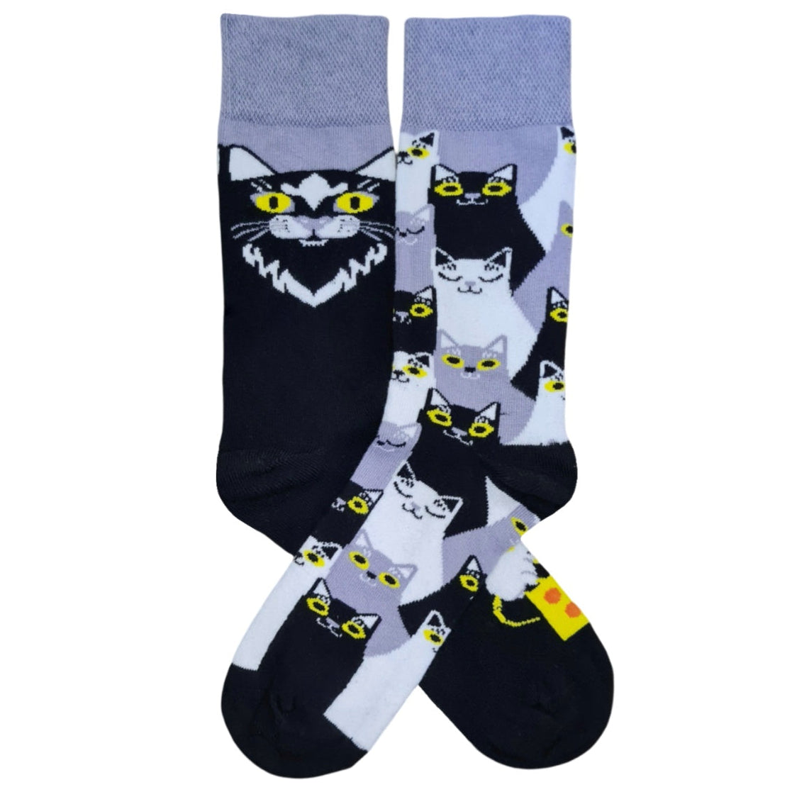 A pair of socks with a pattern of black and white cats looking in different directions.