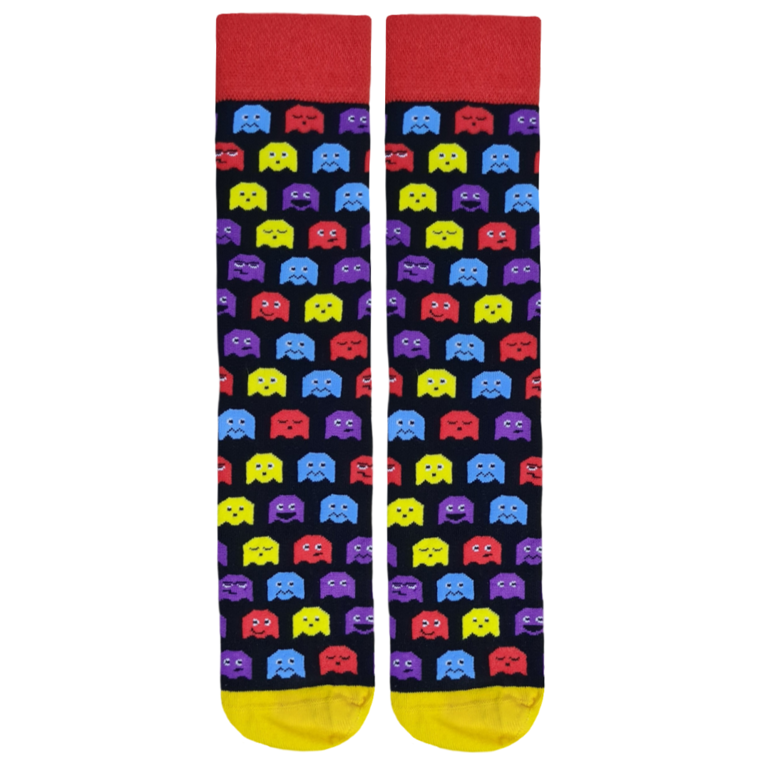 A pair of socks with a pattern of colorful ghost-like figures on a dark background with red and yellow accents at the tips.