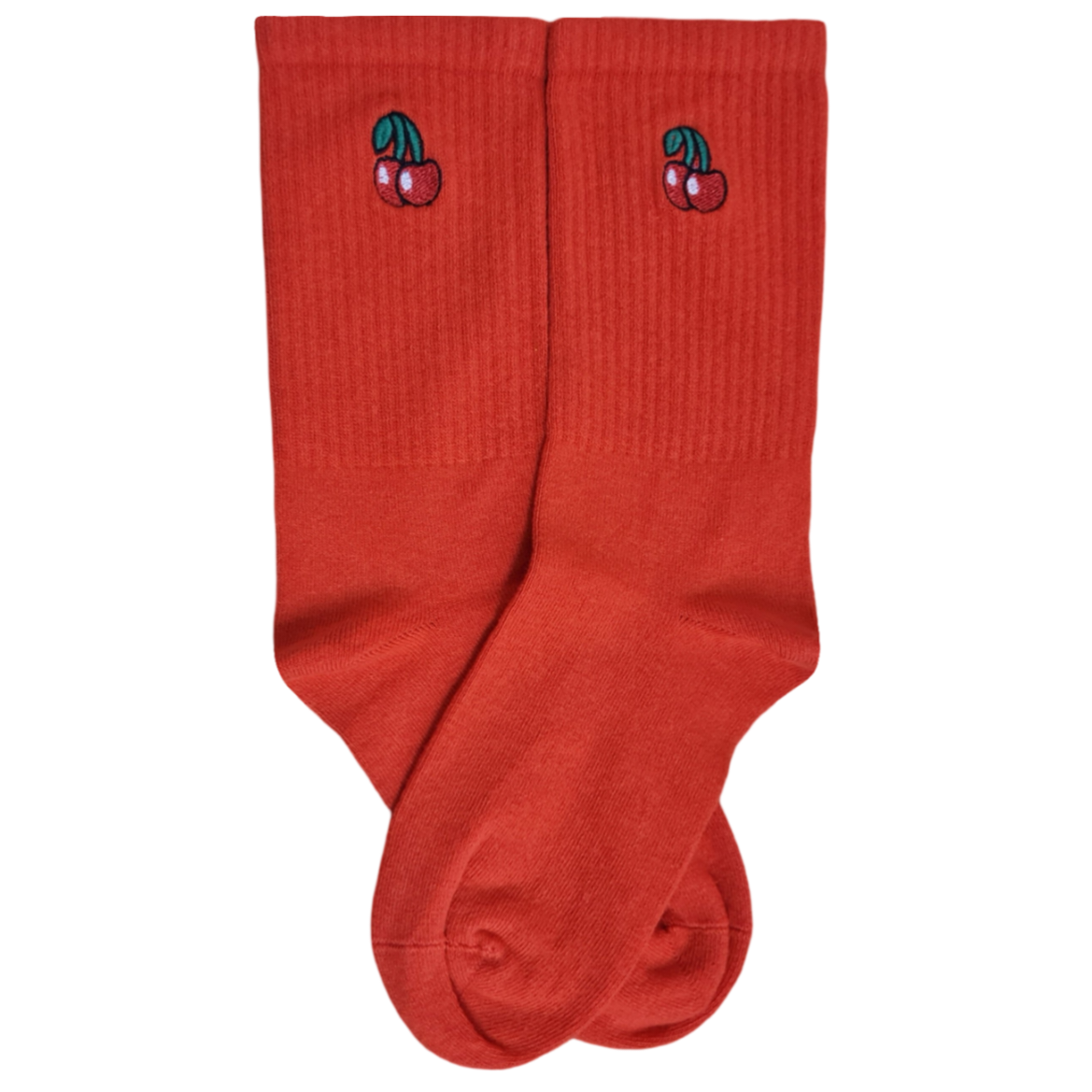 A pair of red socks with embroidered cherries on the side.