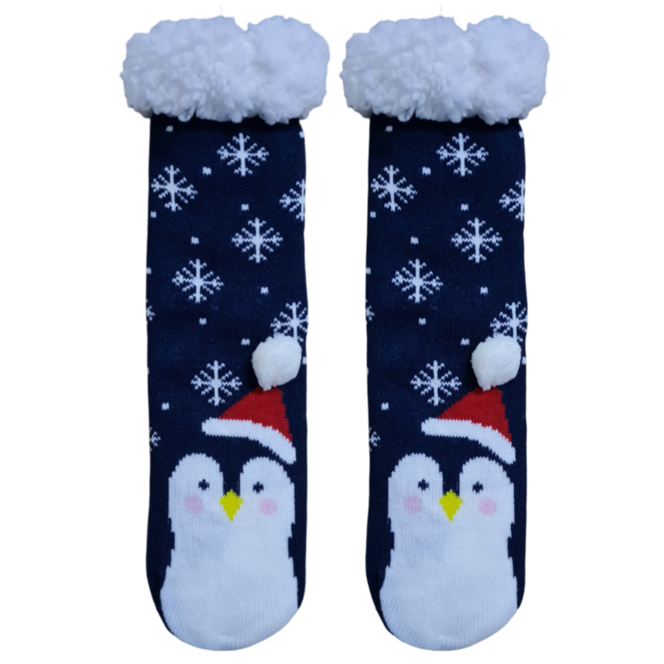 A pair of navy blue socks with a white penguin design and snowflake patterns, featuring a red Santa hat on the cuff.