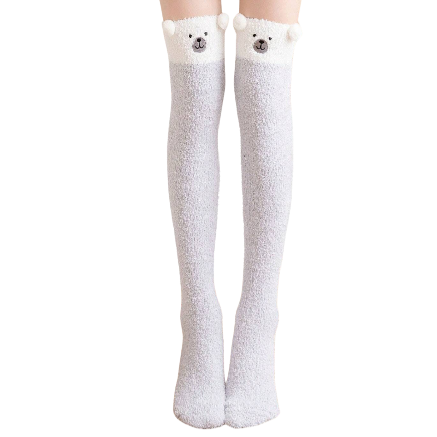 White knee-high socks with bear ears and face on a white background