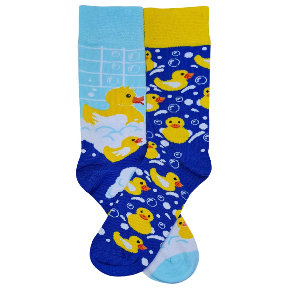 A pair of mismatched socks, one with a blue background and yellow ducks, and the other with a yellow background and blue bubbles.