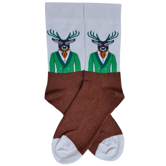 Beige and brown crew socks featuring a deer wearing a green suit, navy vest and orange tie, with green antlers.