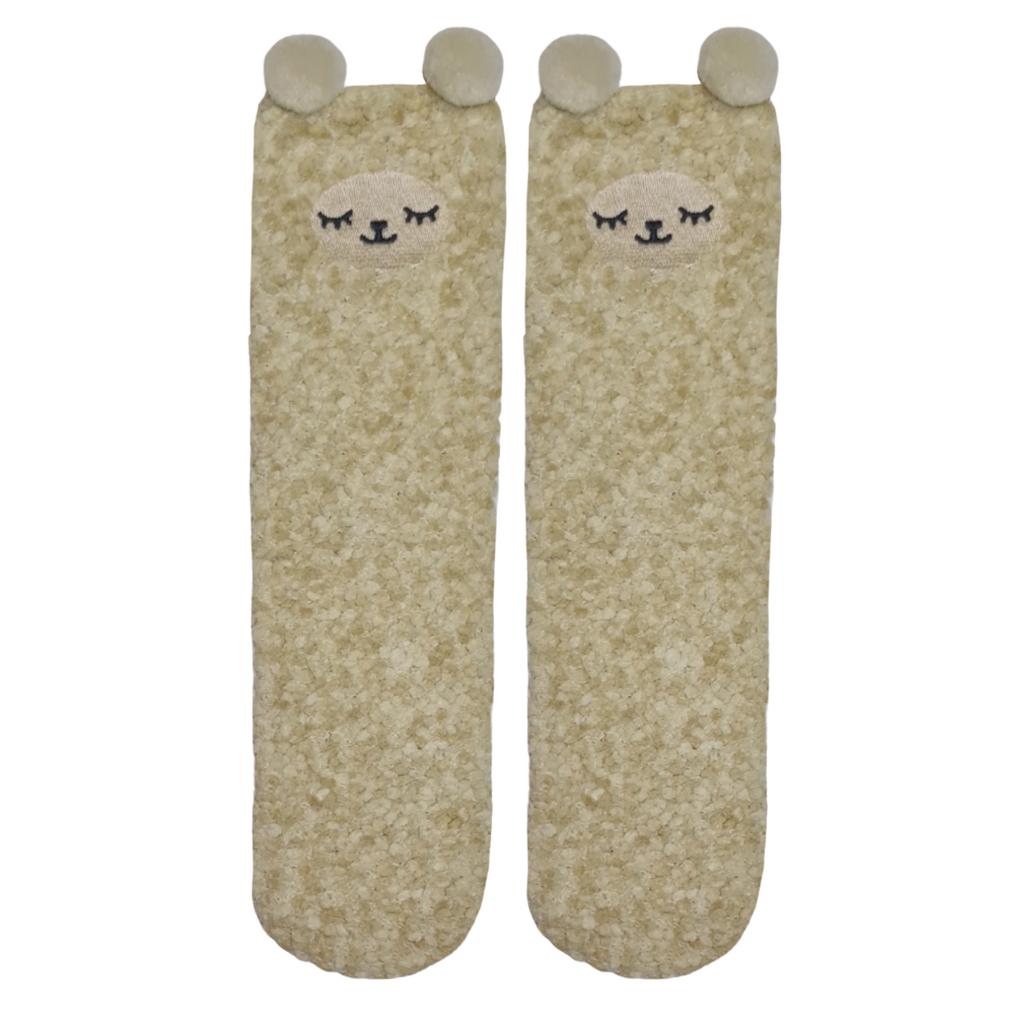 A pair of beige fluffy socks with cartoon llamfaces and ears on the top.a 
