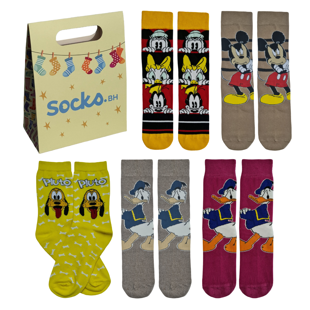 A flat lay presentation of five pairs of colorful Disney socks featuring Mickey Mouse, Donald Duck, Daisy Duck, and Pluto, displayed next to a Socko.bh paper gift bag.