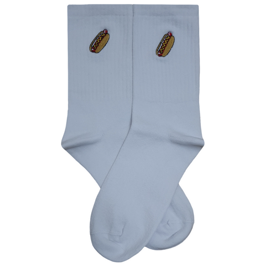 Pair of white crew socks featuring a small, detailed hot dog with mustard embroidery on the upper ankle, displayed on a plain white background.
