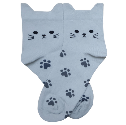 Light grey crew socks with cute 3D cat ears on the upper cuff, a stitched cat face with whiskers, and a scattered dark grey paw print pattern.