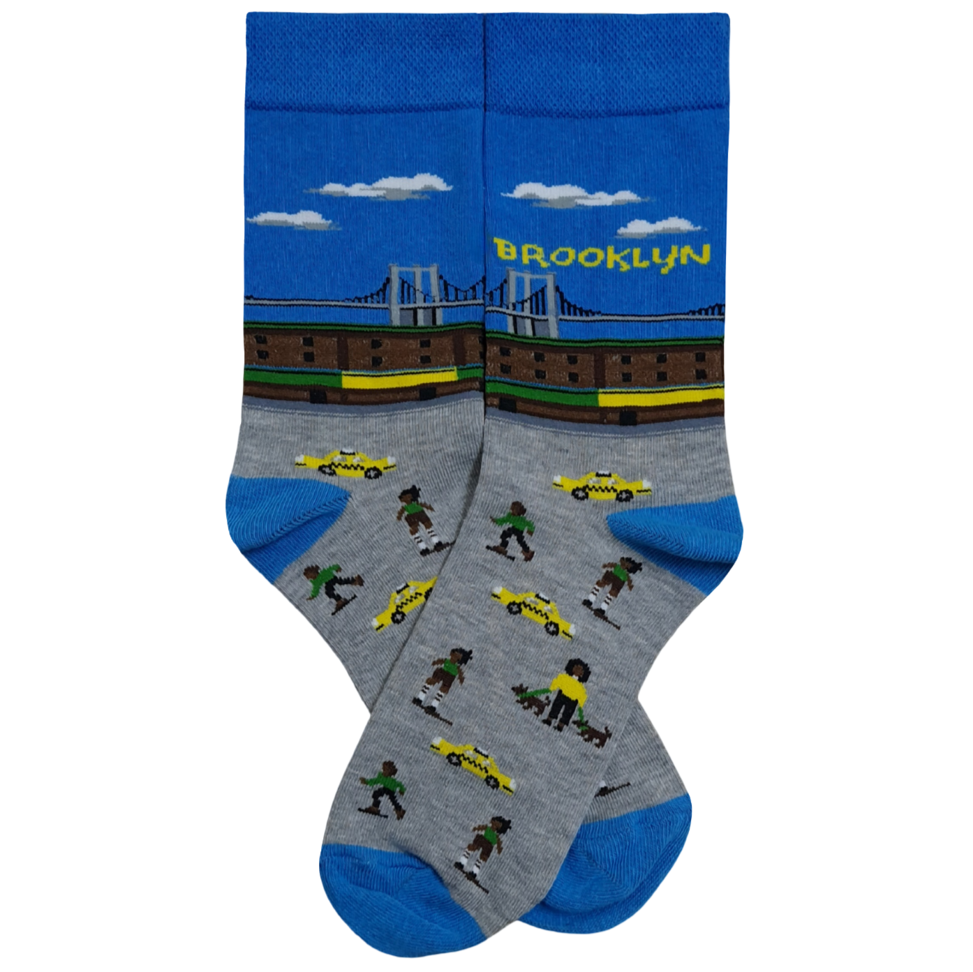 A pair of blue and gray crew socks featuring a pixel art design of the Brooklyn Bridge under a blue sky with white clouds, yellow taxi cabs, and various people walking on a city street.