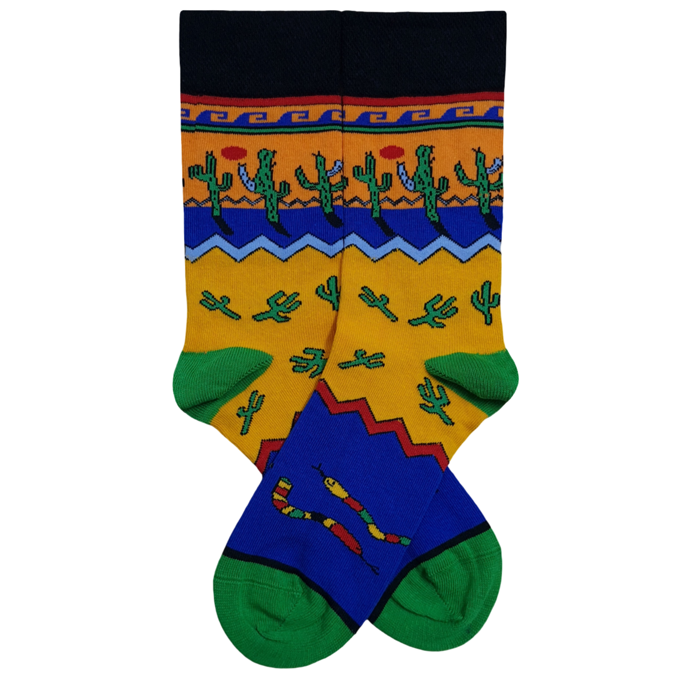 A pair of vibrant crew socks displaying a layered Southwestern desert pattern with rows of green saguaro cacti, multi-colored rattlesnakes, zigzag geometric shapes, and a red sun against blocks of yellow, blue, orange, and green.