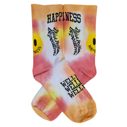 Tie-dye socks with text and smiley faces on a orange background