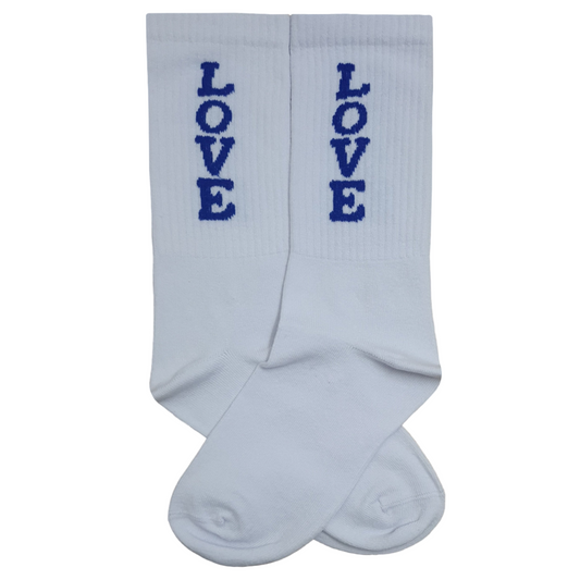 Pair of white mid-calf tennis socks with blue "LOVE" text embroidery and a ribbed texture.
