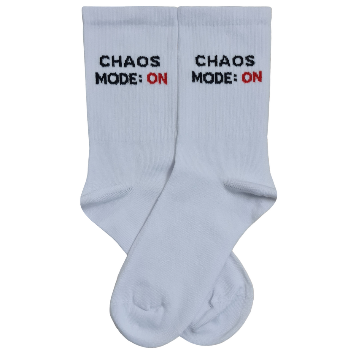 A pair of white crew socks featuring the text "CHAOS MODE: ON" embroidered vertically, with "CHAOS MODE:" in black and "ON" in red.