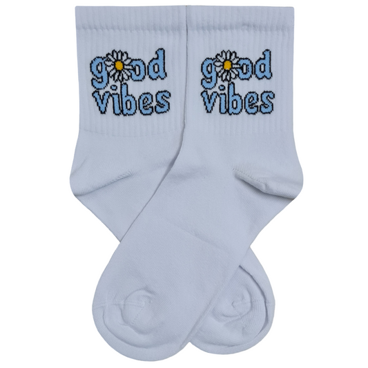 White quarter crew socks featuring the text "good vibes" in a blue pixelated font, with a white and yellow daisy flower inside the letter O.