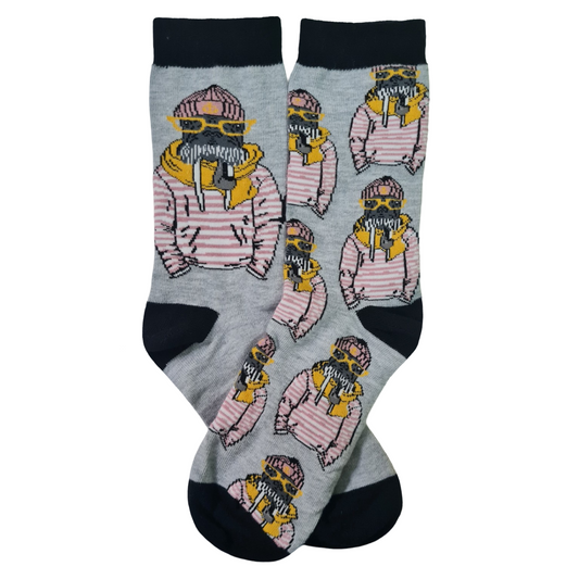 Grey mismatched crew socks featuring a stylish yellow walrus wearing sunglasses, a pink beanie and a pink striped shirt, with black cuffs, heels and toes.